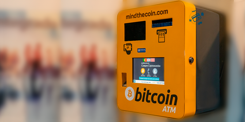Caixa eletrônico ATM da corretora Mind the Coin, laranja, escrito Bitcoin